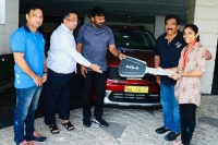 Megastar chiranjeevi presents kia sonet car to gymnast aruna reddy