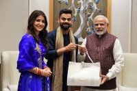 Newly weds virat kohli and anushka sharma meet pm modi