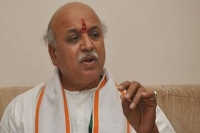 Parivar split wide open as togadia savages modi