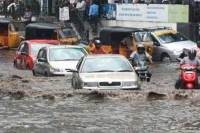 Cars wash away after heavy rain in twin cities