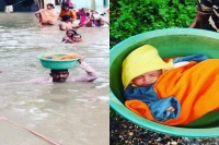 Vadodara cop carries baby girl in tub on his head in neck deep water