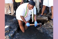 Puducherry cm gets into drain cleans it for swachhata hi seva mission