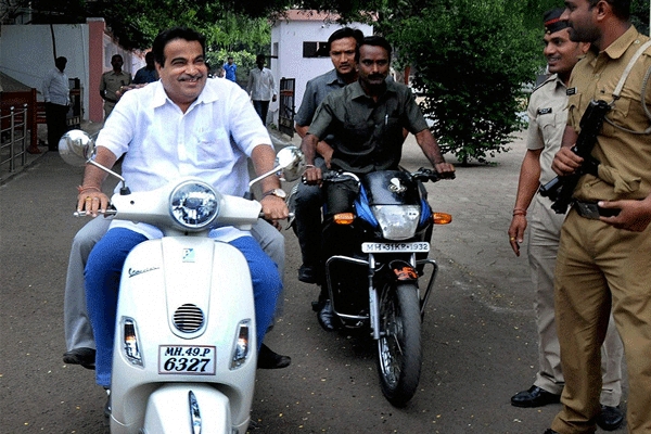 Gadkari courts controversy by riding scooter without helmet